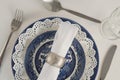 Fork, butter knife, spoon, napkin and lace placemat Royalty Free Stock Photo