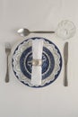 Fork, butter knife, spoon, napkin and lace placemat Royalty Free Stock Photo