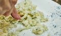 With a fork, the chef kneads mashed potatoes onplate Royalty Free Stock Photo