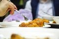 Fork in chicken leg on blurred background Royalty Free Stock Photo
