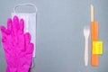 Fork, chopsticks, medical mask, latex gloves and a sticker covid-19 free Royalty Free Stock Photo