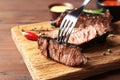 Fork with delicious barbecued steak Royalty Free Stock Photo