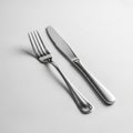 The fork features four evenly spaced tines, while the knife has a smooth, Royalty Free Stock Photo