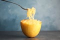 Fork with flesh over cooked spaghetti squash Royalty Free Stock Photo