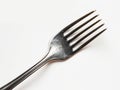 A fork with four tines on a white background Royalty Free Stock Photo