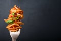 Fork full of twirled italian spaghetti with a bolognese meat sauce and basil. Royalty Free Stock Photo