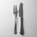 The fork has four tines and the knife has a smooth blade with a rounded Royalty Free Stock Photo