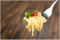 Fork with just spaghetti around it on backgrouund Royalty Free Stock Photo