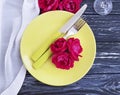 Fork, knife, plate rose flower decor romantic celebrate dinner on wooden background Royalty Free Stock Photo