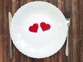 Fork and knife plate white heart wooden celebration Royalty Free Stock Photo