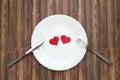 Fork and knife plate white heart wooden Royalty Free Stock Photo