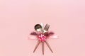 Fork, knife, spoon, silverware with on pink background for catering, Royalty Free Stock Photo