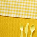 Fork knife spoon on yellow fabric background Royalty Free Stock Photo