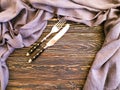 Fork, knife towe equipment kitchenware vintage l on old wooden background texture