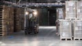 Fork lifter work in big warehouse. Clip. Warehouse man worker with forklift. Warehouse Rack of the Company Royalty Free Stock Photo
