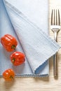 Fork and peppers on blue napkin