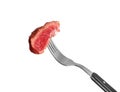 Fork with piece of cooked meat on white background Royalty Free Stock Photo