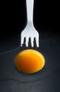 Fork is pricking a egg Royalty Free Stock Photo