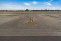 Fork signs, exit from the runway to the taxiways at the airport. Yellow lines markings for aircraft movement with