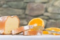 A fork beside a sliced lemon cake, decorated with some fresh ora Royalty Free Stock Photo