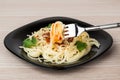 Fork with spaghetti over plate Royalty Free Stock Photo