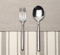 Fork and spoon on canvas napkin