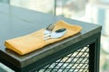 Fork, spoon, knife in a napkin on a wood table Royalty Free Stock Photo