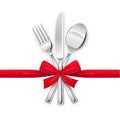 Fork, spoon, knife with red bow. Set of utensils for eating. Royalty Free Stock Photo