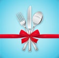 Fork, spoon, knife with red bow. Set of utensils for eating. Royalty Free Stock Photo