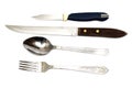 Fork, spoon and two knives on a white background Royalty Free Stock Photo