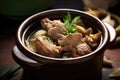 fork-tender carnitas chunks in a rustic clay pot