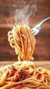 Fork twirling a delicious bite of spaghetti with steam rising creating an inviting ambiance for a perfect meal Royalty Free Stock Photo