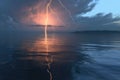 forked lightning strike reflecting on the ocean surface Royalty Free Stock Photo