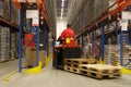 Forkift operator in factory warehouse