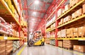 The forklift in the big warehouse on blurred background. 3d illustration Royalty Free Stock Photo