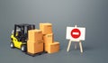 Forklift with boxes and an easel with restriction sign. Restrictions on export of scarce and medical goods for period of border