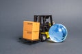 Forklift carrying boxes and blue planet earth glass globe. The concept of commerce and trade, cargo delivery, exchange of goods Royalty Free Stock Photo