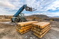 Forklift on a construction site, preparing to raise construction parts Royalty Free Stock Photo