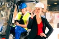 Forklift driver and supervisor at warehouse Royalty Free Stock Photo