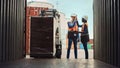 Forklift Driver Loading a Shipping Cargo Container with a Full Pallet with Boxes in Logistics Port