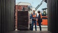 Forklift Driver Loading Shipping Cargo Container with Full Pallet with Boxes in Logistics Port Royalty Free Stock Photo