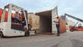 Forklift Driver Loading a Shipping Cargo Container with a Full Pallet with Boxes in Logistics Port Royalty Free Stock Photo