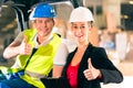 Forklift driver and supervisor at warehouse Royalty Free Stock Photo