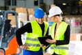 Forklift driver and supervisor at warehouse Royalty Free Stock Photo