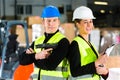 Forklift driver and supervisor at warehouse Royalty Free Stock Photo