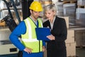 Forklift driver talking with his manager Royalty Free Stock Photo