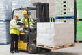 Forklift driver talking with his manager Royalty Free Stock Photo