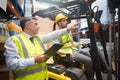 Forklift driver talking with his manager Royalty Free Stock Photo