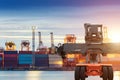 Forklift handling container box loading at port cargo Royalty Free Stock Photo