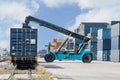 Forklift handling container box loading to freight train